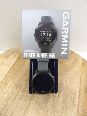 a close up of a watch on a wooden table with a box