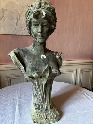 a statue of a woman that is sitting on a table