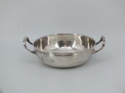a silver plate with handles and handles on a white background