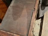 an old wooden table with a drawer on top of it