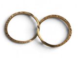 pair of gold wedding rings on a white background