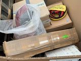 a cardboard box full of boxes and a helmet in it