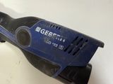 a blue and black electric tool on a white table
