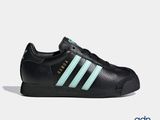 the adidas superstar shoes in black and aqua are on sale