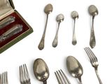 a box of silverware and a set of forks and spoons