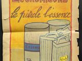 un vieux journal sur lequel figurent le dessin d'une poubelle et une poubelle