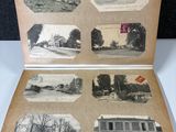 an old photo of an open book with pictures of a house