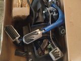 a cardboard box filled with assorted electronic devices