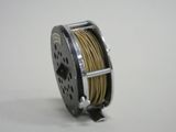 a reel with a spool on it sitting on a table