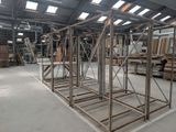a large metal structure in the middle of a warehouse