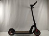 an electric scooter sitting on top of a white surface