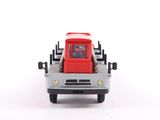a toy truck with a red cab on the back of it