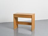 a small wooden table with a shelf on the top of it