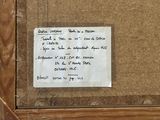 a piece of paper taped to a piece of wood