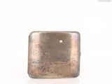 silver square shaped metal object on white surface with white background