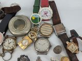 many different types of watches on a white table