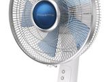 a close up of a white table fan on a stand