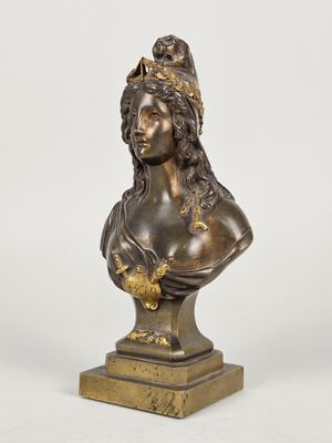 a bronze bust of a woman with a crown on her head