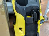 a yellow and black machine that is sitting on the floor