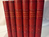 a set of five red books sitting on top of each other