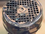 a close up of a metal object with a hole in it