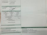 a picture of a receipt sitting on a wooden table