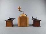 three different types of coffee grinders on a gray background