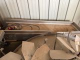 a machine that is sitting in a room with a lot of debris