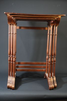 an image of a small wooden table on a grey background