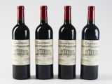three bottles of red wine sitting next to each other on a white surface