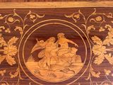 a wooden box with a picture of a man and a woman on it