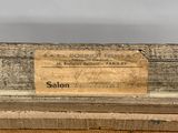 a close up of a piece of wood with a label on it