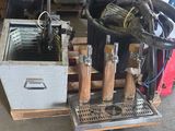 a bucket with a bunch of tools in it sitting on a pallet
