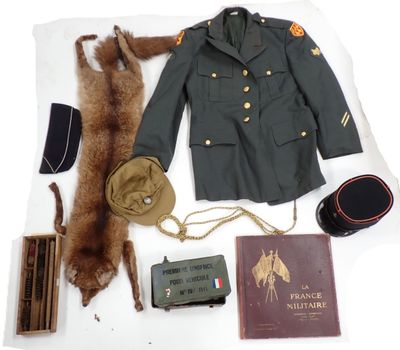 a military uniform and other items laid out on a table