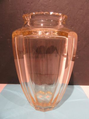 a glass vase that is sitting on a table