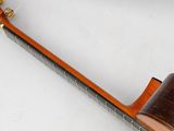 an image of a guitar with a wooden body and strings