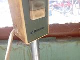 an image of a computer on a stand in front of a window