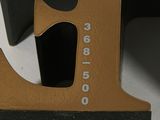 a wooden letter that has a number on it