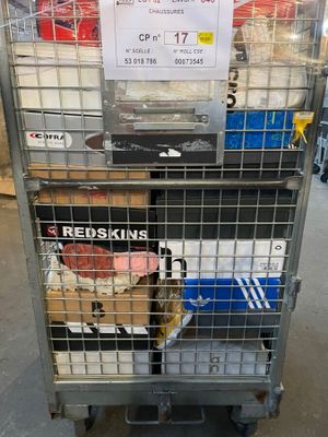 a metal cart with a bunch of items in it