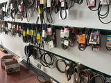 a wall of electrical cords and wires on the wall