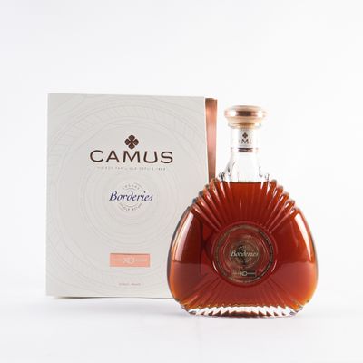 a picture of a bottle of brandy in front of a box
