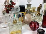 many different types of perfume bottles on a table