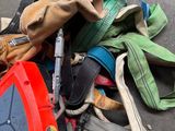 a pile of clothing and tools sitting on the ground