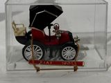 a small model of a car in a clear box