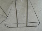 a metal frame with a sail on it sitting on the floor