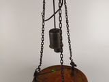an image of a wooden bowl with chains hanging from it
