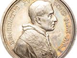 an image of a silver coin with a portrait of a man on it