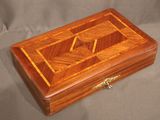 an image of a wooden box with a design on it