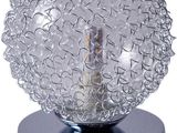 a glass ball that is sitting on a metal base