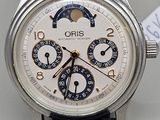 a close up of a wrist watch with a leather strap